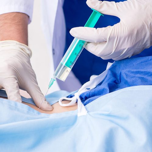 The female patient getting an injection in the clinic